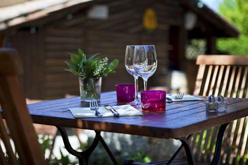 Wine glasses on outdoor table setting