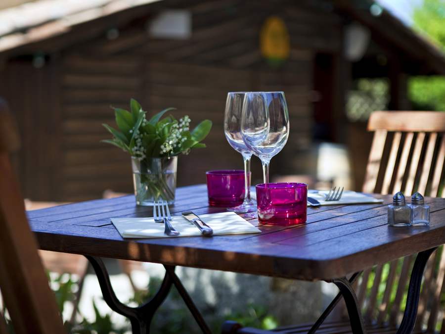 Wine glasses on outdoor table setting